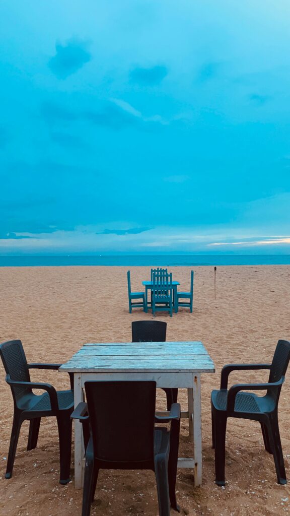 brown wooden chair on beach